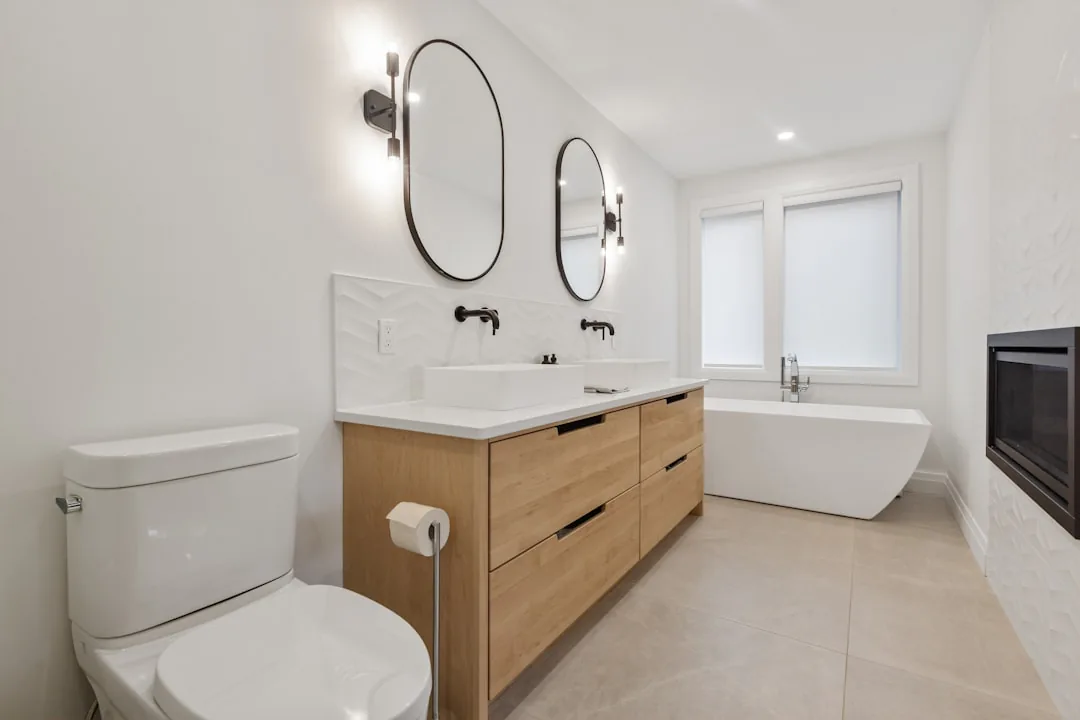 Clean modern bathroom with double sinks and freestanding bath
