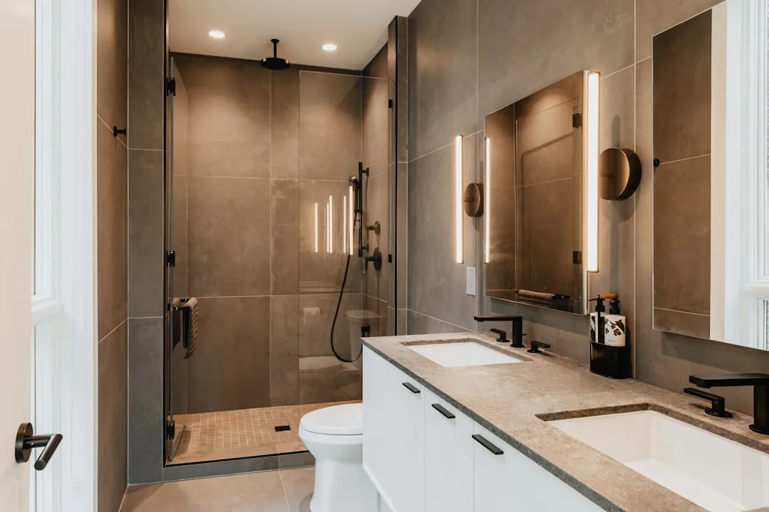 Modern bathroom with twin sinks and plumbing fixtures